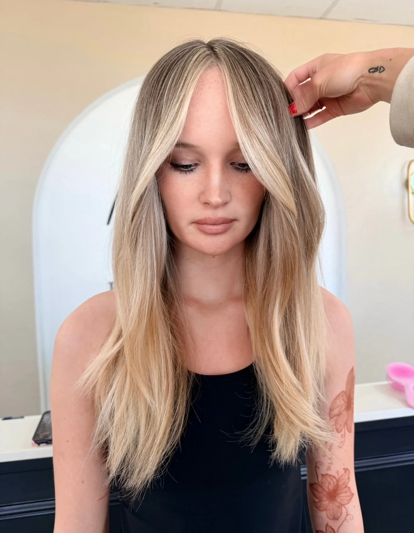 Long dimensional blonde hair finished with soft face-framing layers