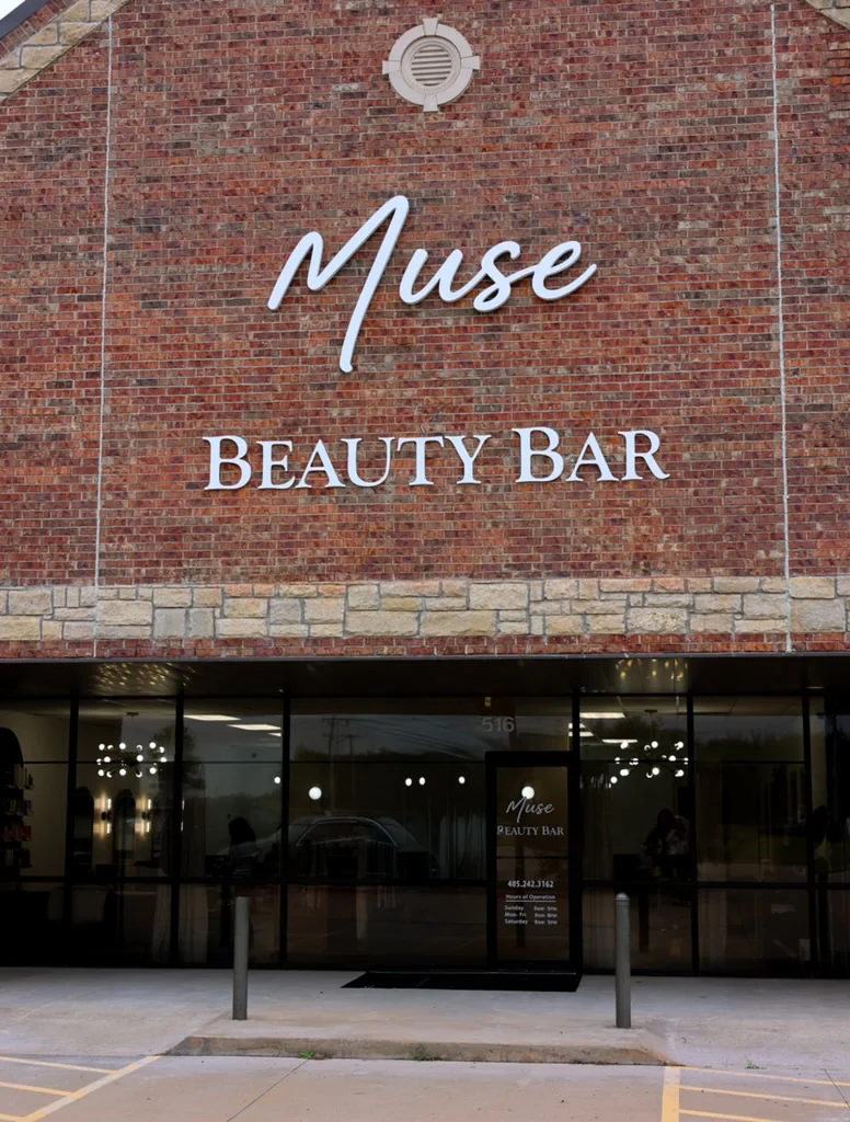 Brick storefront of Muse Beauty Bar in Edmond